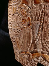 Carving of a goddes holding a lotus flower