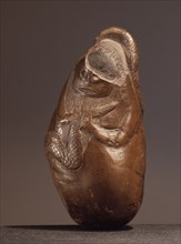 An ancient Indonesia cult object, thought to be a snake god or demon