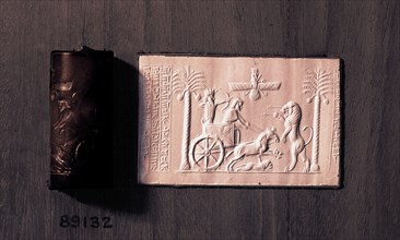 Cylinder seal and impression depicting the Great King Darius in a chariot hunting lions