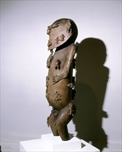 Unique sculpture representing Tangaroa, creator and sea god of Polynesia, in the act of creating the other gods and men, seen on the surface of his face and body