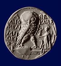 Athenian four drachma (tetradrachm) coin with the symbols of the city, the owl and the statue of Athena Parthenos