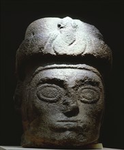 Stone head with turban like headdress
