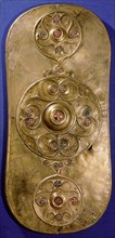 Bronze shield decorated with studs in red glass paste
