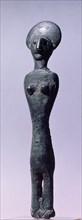 Bronze female statuette, found in association with a figurine of a horned god