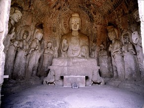 The Longmen cave temple complex which extends for about 1000m along the Yi River