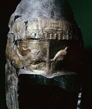Silver helmet with engraved golden eyes
