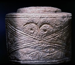 One of the three Folkton drums, found in a child burial in a round barrow excavated by William Greenwell in 1889