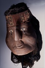 Elaborate death mask with textile headband