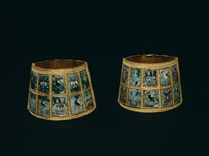 Arm bands made from two hinged pieces of gold with coloured cloisonne enamels set in panels all round
