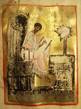 A illumination depicting St Mark writing at his desk