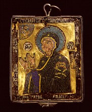 A small gold and enamelled reliquary which would have been worn around the neck to protect the owner from harm