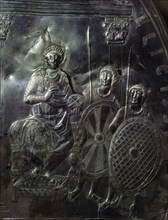 A detail of the Missorium of Theodosius showing the future Emperor Arcadius seated on a throne & guarded by two soldiers