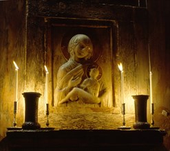 Marble relief of the Virgin Hodegetria in San Marco, Venice, lit by candlelight