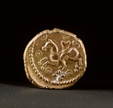 Gold coin with a horse and rider