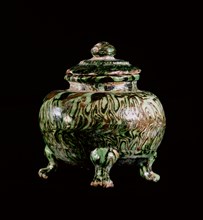 Green and brown glazed vessel with lid on three legs
