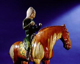 Detail of a tomb figure in the form of a musician (drummer) mounted on a horse