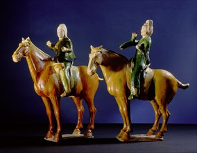 Tomb figures of a drummer and a trumpeter, both mounted on horses