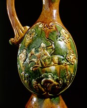 Detail of a ewer decorated in relief with a galloping horseman bearing a bow