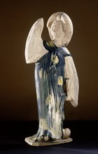 Blue glazed figure of a court lady with one arm raised