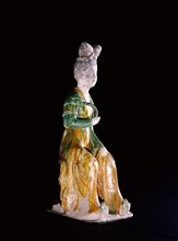 Figure of a seated court lady holding a lotus stem