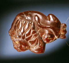 Lion pendant propably worn as an amulet