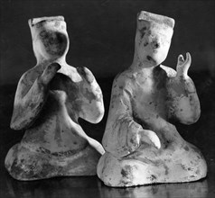 Clay figurines, possibly a musician and a singer