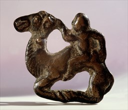 An openwork plaque portraying a man and a camel