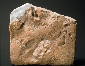 Lower part of trial piece with face, possibly of Akhenaten