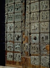 Detail of the bronze door of the Basilica of San Zeno which is decorated with 48 panels illustrating biblical stories and the lives of St Peter, St Paul, St Zeno, St Helena among others, and items con...