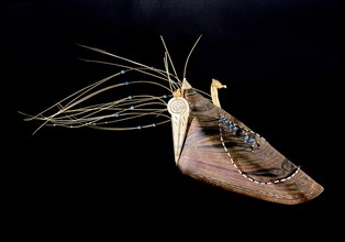 Long visored bentwood hunting hat worn by high status Aleut men early in the 19th century, both indicating their rank and making the wearer birdlike