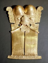 A Darien pectoral in the so called Darien sub style which occurs in several cultures from central to northern Colombia