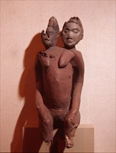 Two headed female figure