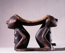 Twa pygmy headrest supported by male and female figures
