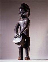 Among the Mbala, wooden sculptures of drummers were kept in the chiefs house as a symbol of his authority