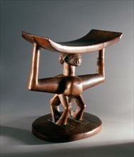 Wooden Mbala headrest with janiform caryatid figure support