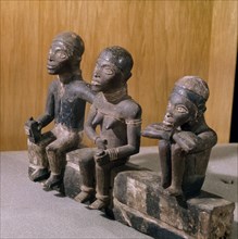 A Kongo or Yombe carving depicting a bridegroom in European clothes, together with his bride and a relative