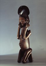 Yaka sculpture of a kneeling woman