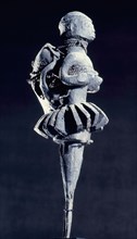 The calabash chips forming the skirt of this bocio figure link it to Fa, the deity and system of divination