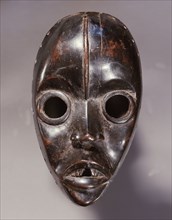 Mask of a type called Zakpei, whose sole function is to patrol northern Dan villages during the dry season making sure that women extinguish their cooking fires before the onset of winds that whip up ...