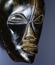 Mask of a type called Deangle, which collects food from village women and brings it to boys secluded in the bush circumcision camp