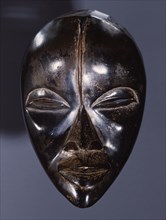 Mask of a type called Deangle, which collects food from village women and brings it to boys secluded in the bush circumcision camp