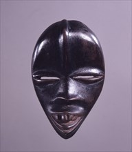 Sometimes called passport masks, these miniature masks are known as ma go, small heads