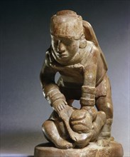 Soapstone pipe, generally assumed to depict a warrior beheading his victim