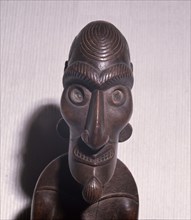 An ancestral figure known as a moai kavakava, emaciated man, worn hung onto its owner at dances and feasts