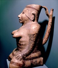 Effigy jar with stirrup spout depicting a painted or tattoed female figure