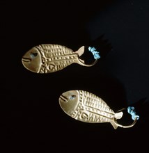 Gold earrings in the form of fish