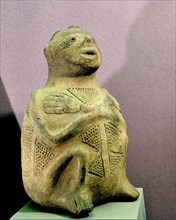 Pottery effigy vase depicting a human being