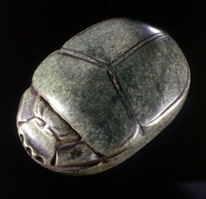 Heart scarab inscribed for Hat, with a text from chapter 30 of the Book of the Dead