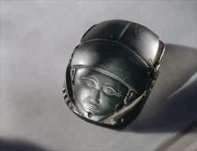 A human faced heart scarab, which was placed on the deceaseds heart during burial rites