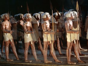 Wooden model of a troop of forty Egyptian soldiers carrying shields and lances